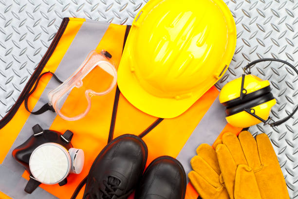 Protective equipment including hard hat, gloves, safety glasses and boots